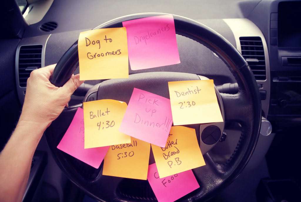 Steering wheel covered in sticky notes