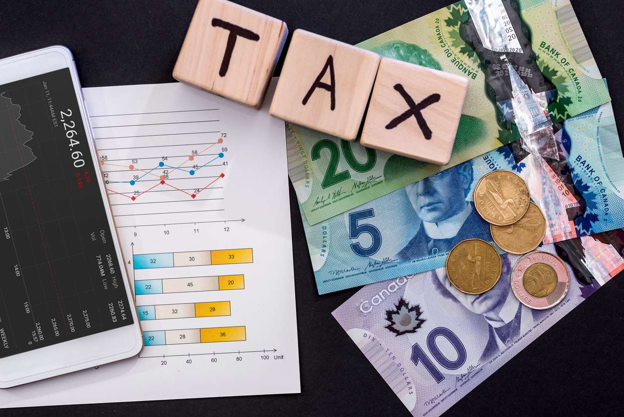 Taxation concept image with Canadian cash